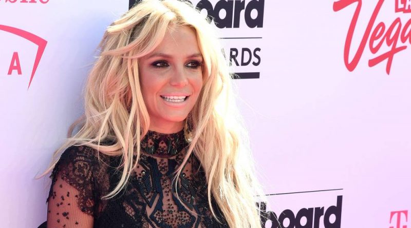 Britney Spears black dress smile
