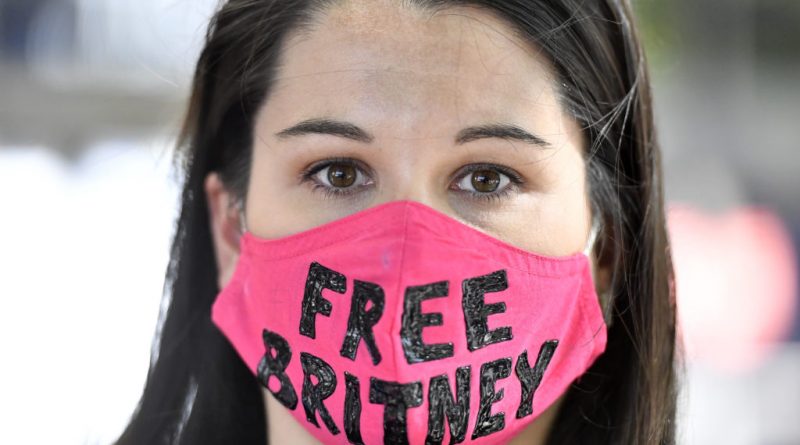 A #FreeBritney supporter wearing a pink face mask