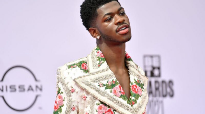 Lil Nas X in a floral suit with a super-wide lapel