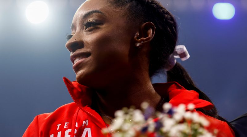 Olympic champ Simone Biles out of team finals with apparent injury