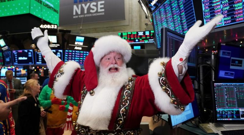 Santa Clause gestures on the floor at the closing bell of the Dow Industrial Average at the New York Stock Exchange on December 5, 2019 in New York. - Wall Street stocks finished slightly higher  following a choppy session that avoided the big swings from earlier in the week on trade-oriented headlines. US and Chinese negotiators are working to finalize a preliminary trade deal announced in October that would block new tariffs expected to take effect this month. Officials have sent mixed signals on the talks, sending shares gyrating. (Photo by Bryan R. Smith / AFP) (Photo by BRYAN R. SMITH/AFP via Getty Images)