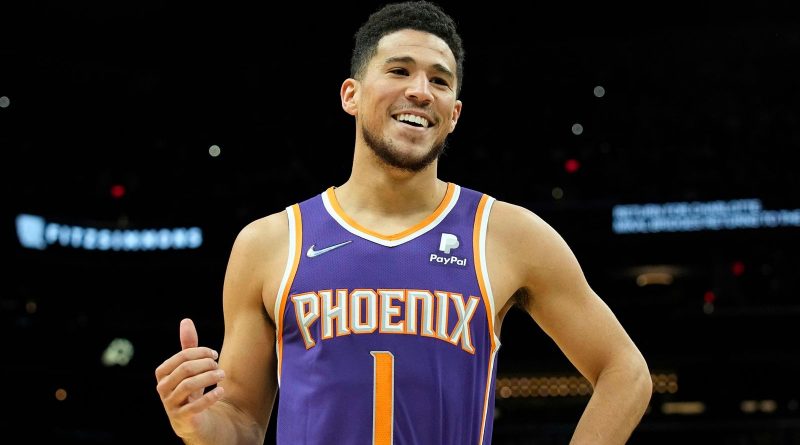 Phoenix Suns guard Devin Booker (1) during the first half of an NBA basketball game against the Charlotte Hornets, Sunday, Dec. 19, 2021, in Phoenix. (AP Photo/Rick Scuteri)