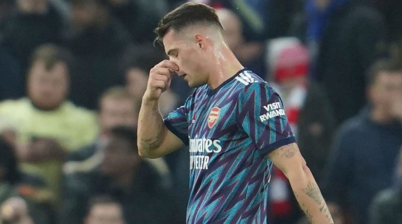 Arsenal's Granit Xhaka leaves the pitch after being sent off during the EFL Cup semifinal, first leg soccer match between Liverpool and Arsenal at the Anfield Stadium in Liverpool, Thursday, Jan.13, 2022.(AP Photo/Jon Super)