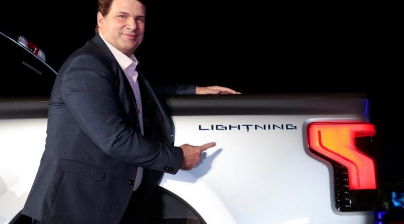 Ford CEO Jim Farley poses with the Ford F-150 Lightning pickup truck in Dearborn, Michigan, U.S., May 19, 2021.  Picture taken May 19, 2021. REUTERS/Rebecca Cook