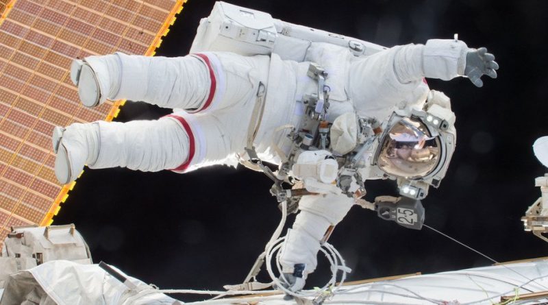 NASA astronaut Scott Kelly is seen floating during a spacewalk on 21  December 2015 as he and fellow astronaut Tim Kopra released brake handles on crew equipment carts on either side of the space station.