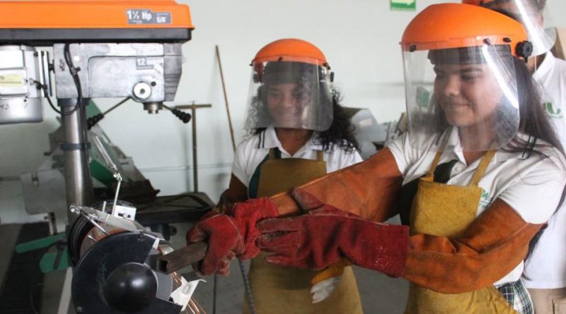 Young women attend a welding workshop in Mexico.