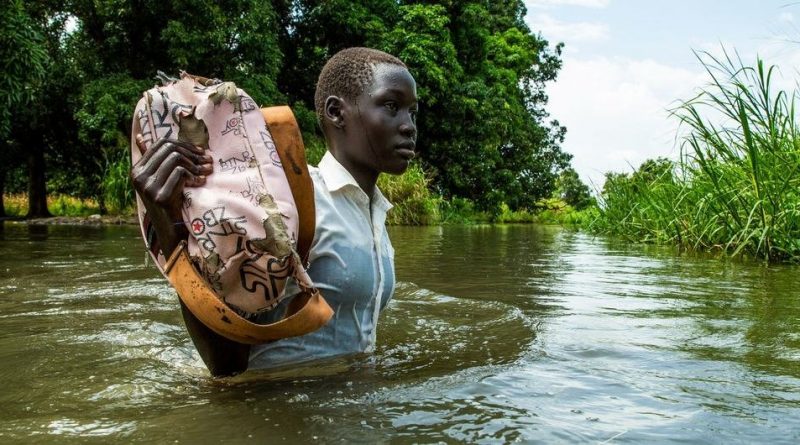 A girl walks home from school after the Nile river flooded on the outskirts of Juba, South Sudan.