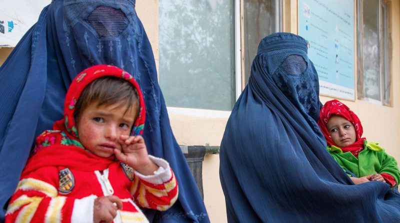 Women wait for their children to be screened for malnutrition at a clinic in Balkh Province, Afghanistan.
