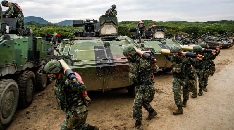 Taiwanese soldiers carry artillery to tanks during a two-day, live-fire drill, amid intensifying military threats from China, in Pingtung county, Taiwan, Sept. 7, 2022. (Ceng Shou Yi—NurPhoto/Getty Images)