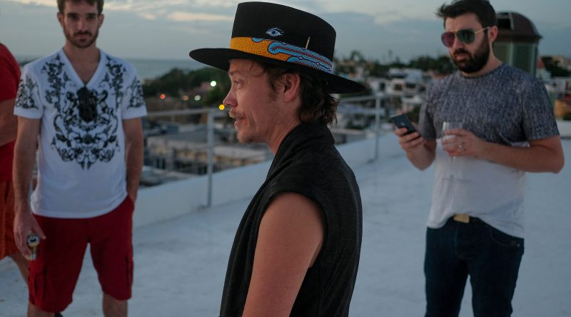 Brock Pierce, center, with Josh Boles, left, and Matt Clemenson on the roof of the Monastery Art Suites, which they rented out as a headquarters for their cryptocurrency business, in San Juan, Puerto Rico, January 2018. Dozens of entrepreneurs, made newly wealthy by virtual currencies, moved to the island to avoid taxes and to build a society that runs on blockchain. (José Jiménez-Tirado—The New York Times/Redux)