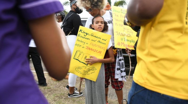 People calling for slavery reparations protest outside the entrance of the British High Commission during the visit of the Duke and Duchess of Cambridge in Kingston, Jamaica on March 22, 2022. (RICARDO MAKYN/AFP via Getty Images)