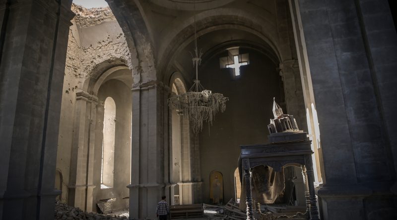A man walks inside the damaged Ghazanchetsots (Holy Saviour) Cathedral in the historic city of Shusha, October 2020. (Aris Messinis—AFP/Getty Images)