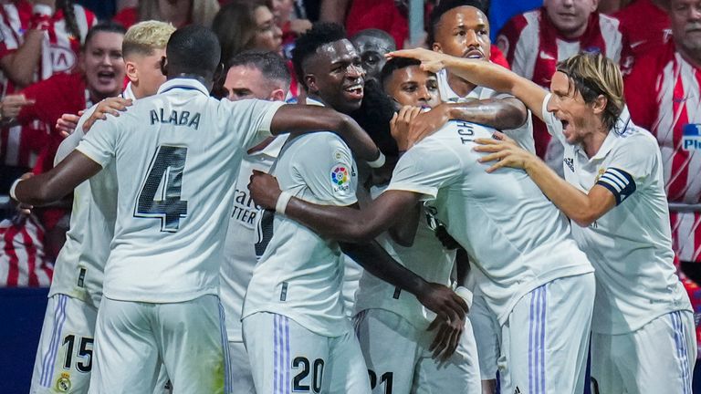 Real Madrid players celebrate after teammate Rodrygo scored the opening goal in the Madrid derby