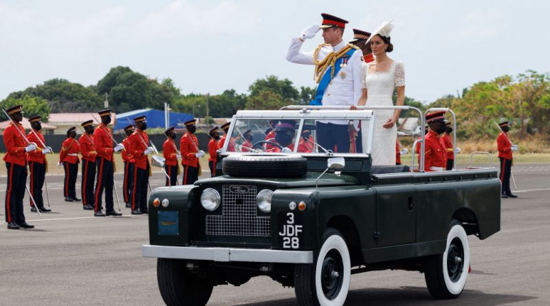 Catherine, Duchess of Cambridge and Prince William, Duke of Cambridge, ride in a Land Rover as they attend the inaugural Commissioning Parade for service personnel from across the Caribbean at the Jamaica Defence Force on day six of the Platinum Jubilee Royal Tour of the Caribbean on Mar. 24, 2022 in Kingston, Jamaica. (Samir Hussein—WireImage via Getty Images)