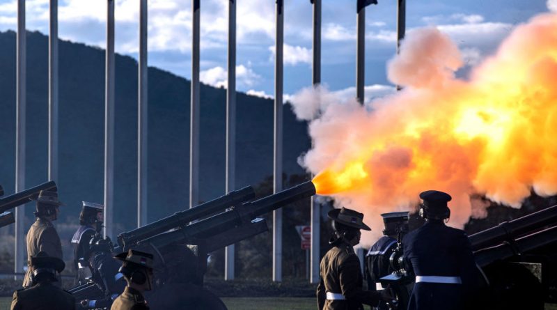 Soldiers fire a 96-gun salute to honor the life of Queen Elizabeth II at dusk in front of Parliament House in Canberra on September 9, 2022. (AFP via Getty Images)