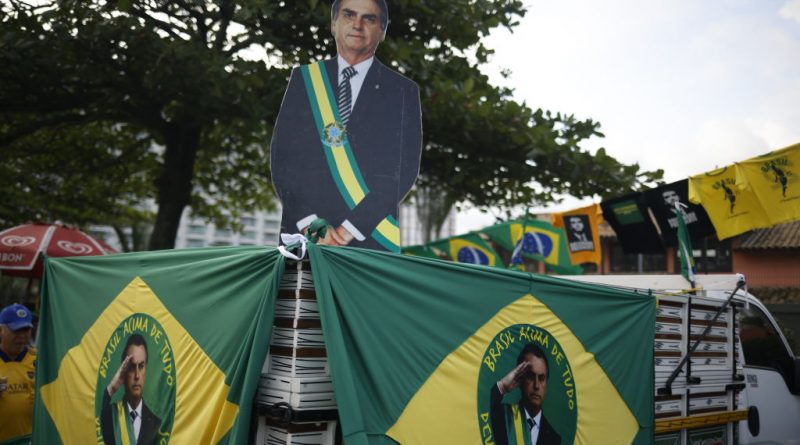 Supporters of president Jair Bolsonaro gather in front of the condominium where the president has a home, in Barra da Tijuca, west zone of Rio, during presidential election day on Oct. 2, 2022 in Rio de Janeiro, Brazil. (Wagner Meier—Getty Images)