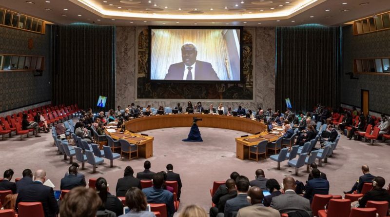 Moussa Faki Mahamat (on screen), Chairperson of the African Union Commission, briefs the Security Council meeting on cooperation between the UN and regional and subregional organizations in maintaining international peace and security.