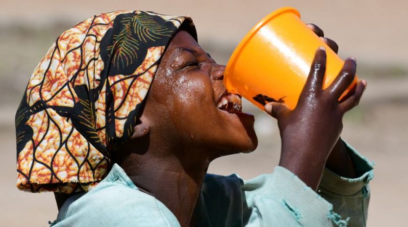 A girl drinks water in the playground of her school, in Goré, in the South of Chad.