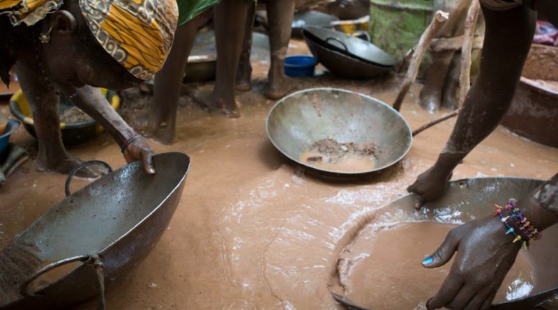 Women pan for gold by using mercury at the Worognan mining site in Bougouni, Mali.