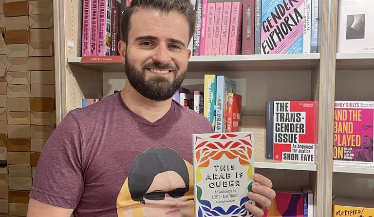 Elias Jahshan, the Editor of 'This Arab is Queer,' with a copy of the anthology. (Elias Jahshan)