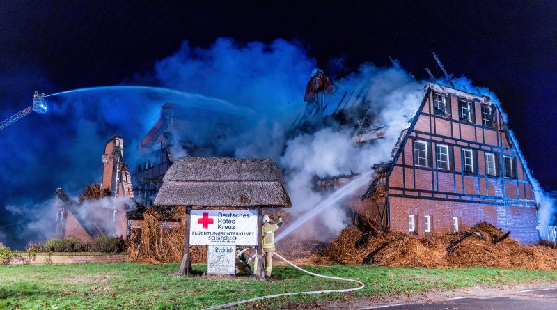 Firefighters extinguish the fire in a hotel where refugees from Ukraine were accommodated in Gross Stroemkendorf, Germany, on Oct.20. (Jens Büttner—dpa/AP)
