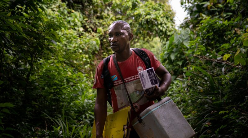 A nurse transports vaccines to remote villages on the banks of the Congo River in the Democratic Republic of the Congo.