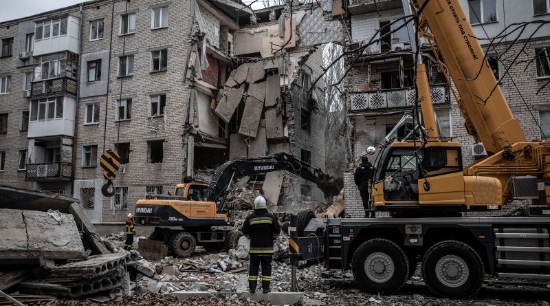 Rescue workers at a damaged apartment block in Mykolaiv on Nov. 11, 2022. (Finbarr O'Reilly—The New York Times/Redux)