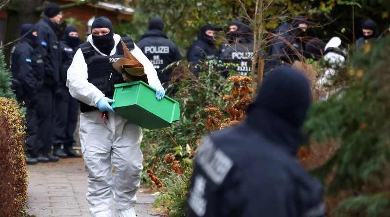 Police secure an area in Berlin after 25 suspected members and supporters of a far-right group were detained during raids across Germany, Dec. 7, 2022. (Christian Mang—Reuters)