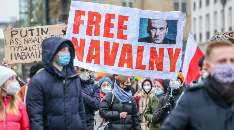 Protesters hold a banner reading "FREE NAVALNY" as some 2,500 supporters of Russian opposition politician Alexei Navalny march in protest to demand his release from prison in Moscow on January 23, 2021 in Berlin, Germany. (Omer Messinger-Getty Images)