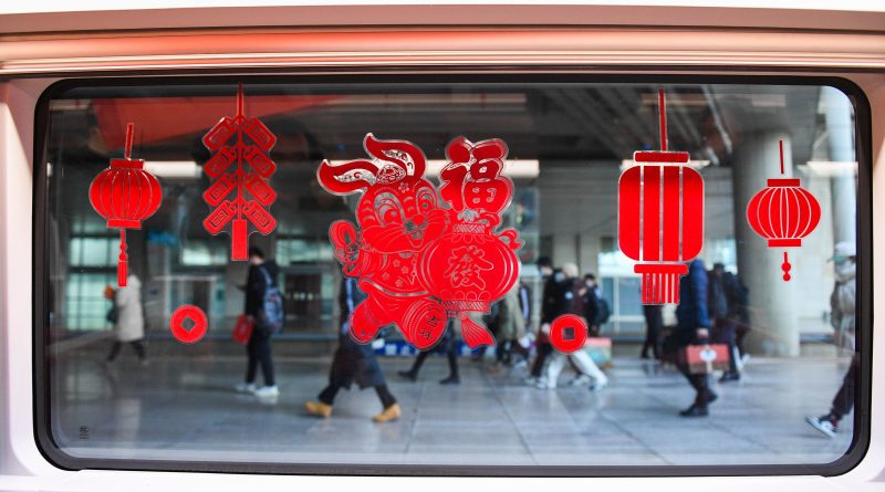 Decorations adorn the Fuxing bullet train G2457, which travels from Beijing to Hohhot, at Hohhot East Railway Station in Hohhot, Jan. 14, 2023. (Liu Lei—Xinhua/Getty Images)